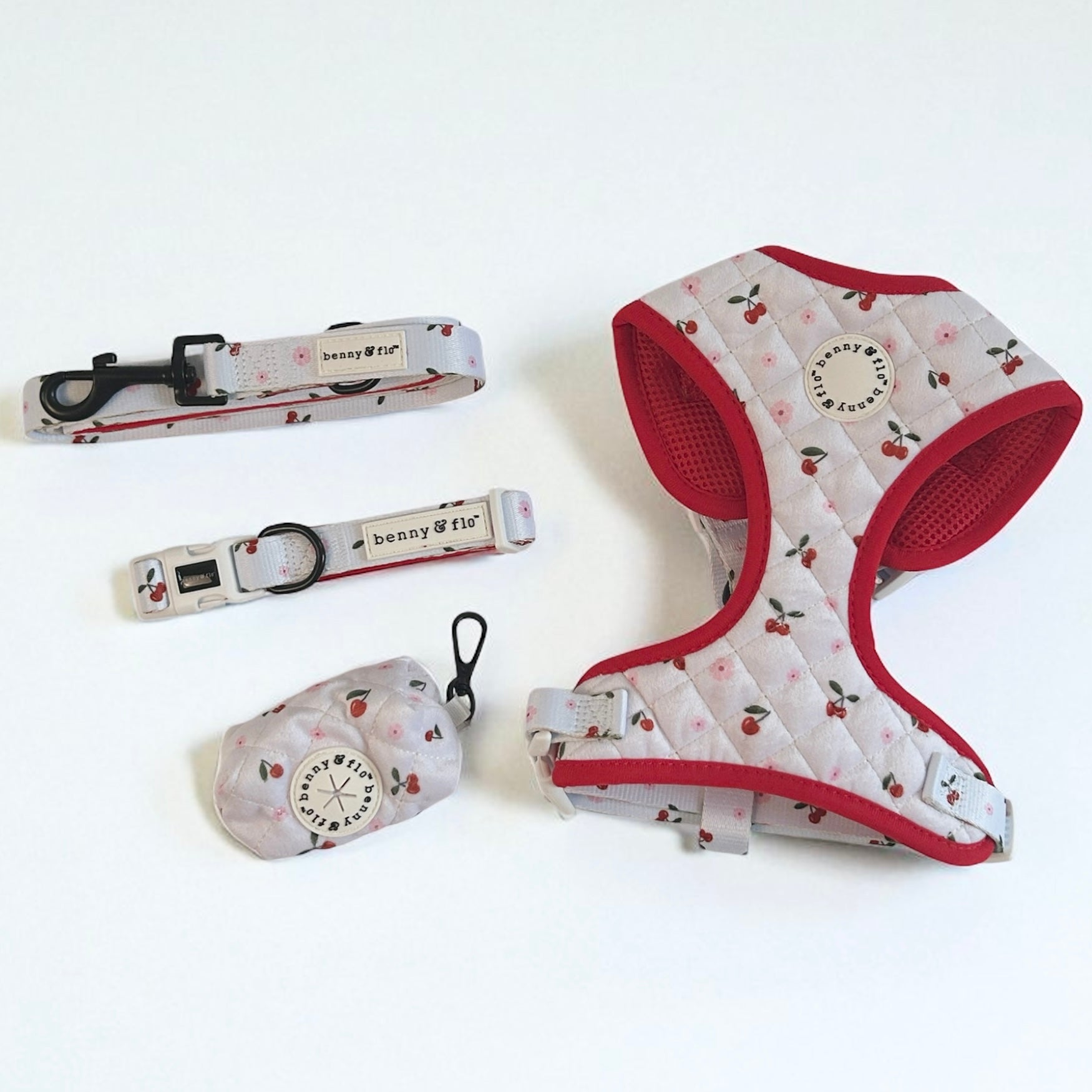 Dog harness, collar, and leash set with cherry pattern on a white background