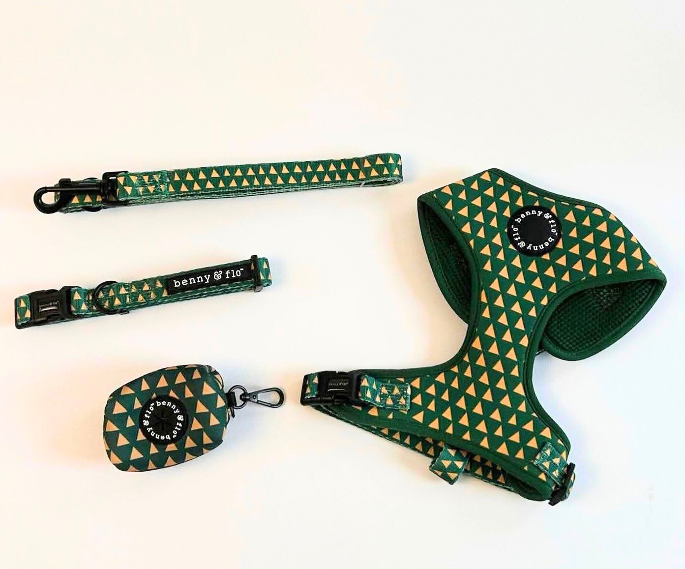 Green and yellow patterned dog collar, harness, and leash set on a white background