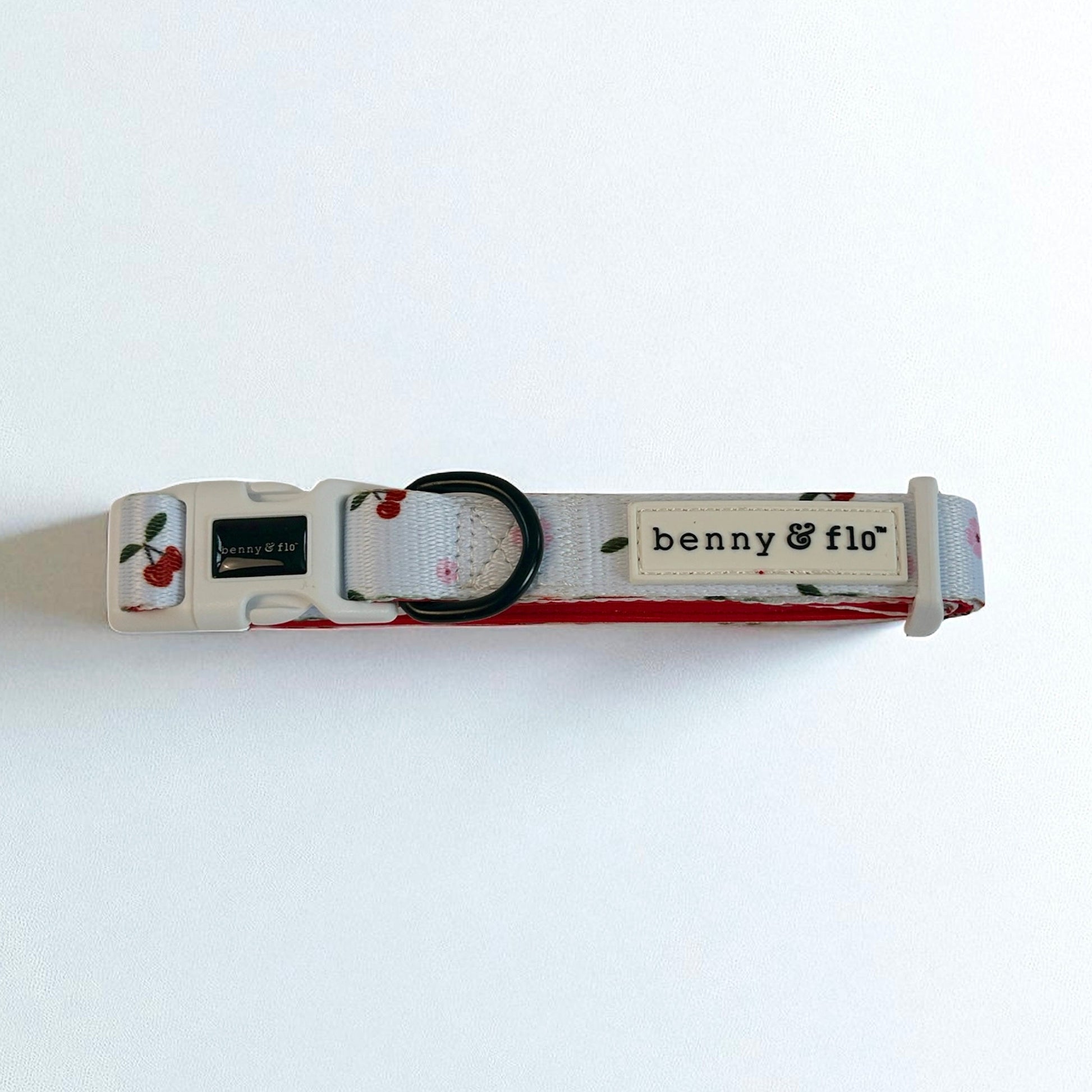 Cherry theme dog collar with 'benny & flo' branding on a white background